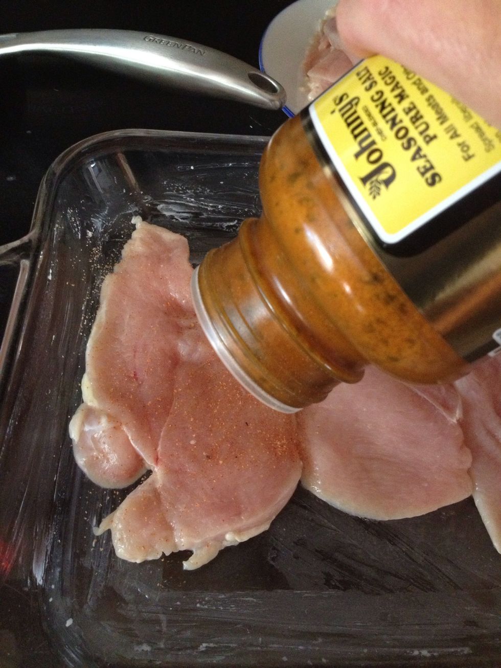 Sprinkle  the Johnny's seasoning liberally all over the chicken piece. Then, flip and get the other side as well.
