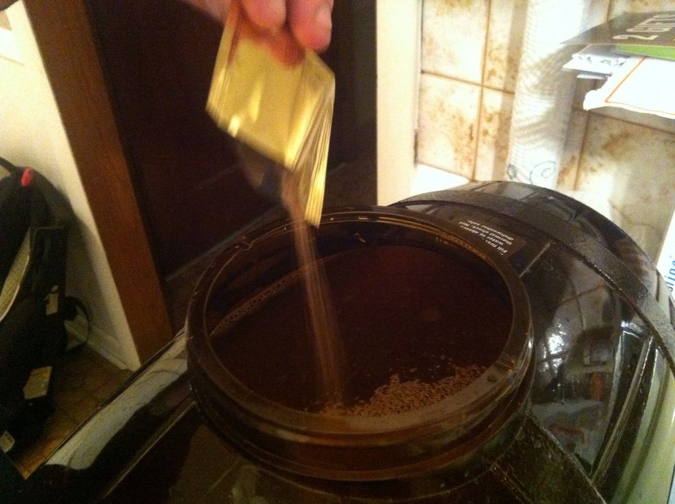 Sprinkle the packet of yeast in the top. Do not stir this in! Put the lid on tight. Now, time to find a dark spot with a steady temperature between 68 - 76 degrees F.