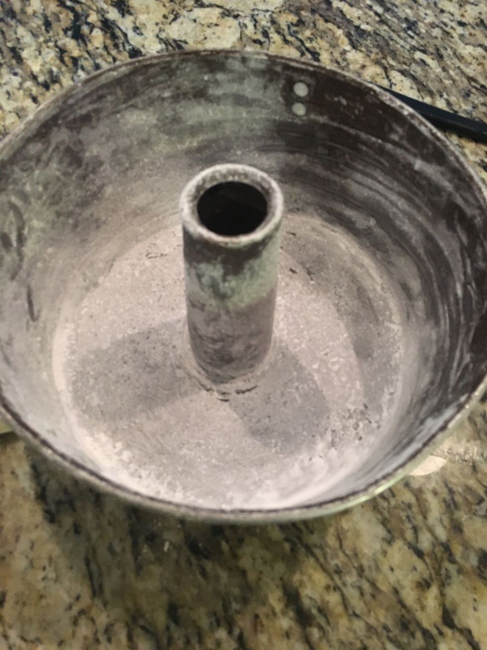 Sprinkle the pan with flour so the cake won't stick