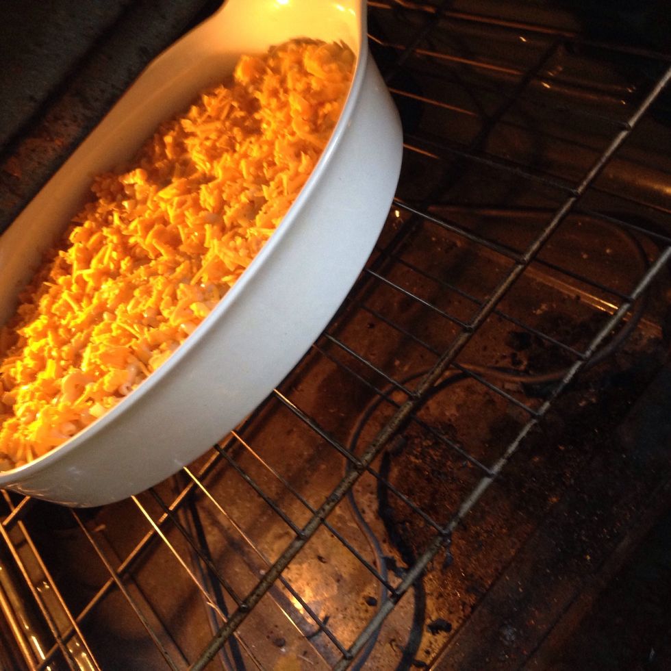 Sprinkle the remaining cheese on top and then place baking pan into preset oven of 375 degrees! Do not overcook! You want creamy bubbly Mac and cheese
