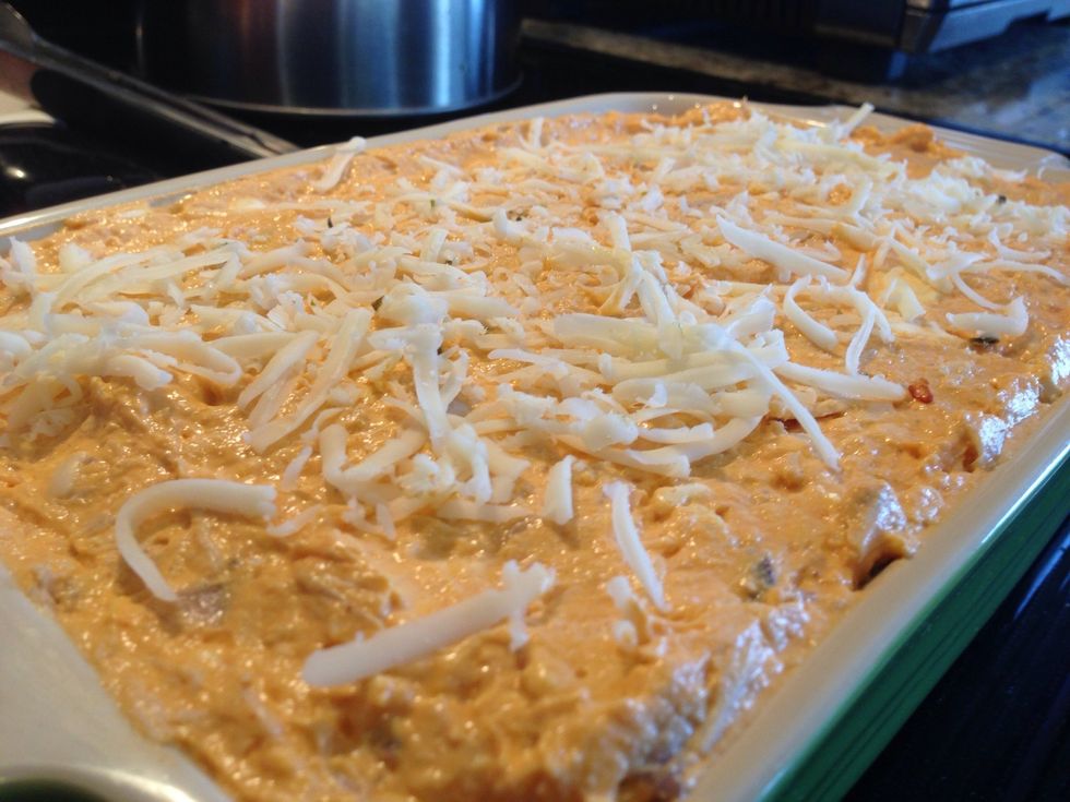 Sprinkle the remaining pepper jack on top. Pre-heat oven to 400 degrees and then cook for 15-20 minutes. Serve with crackers and celery.