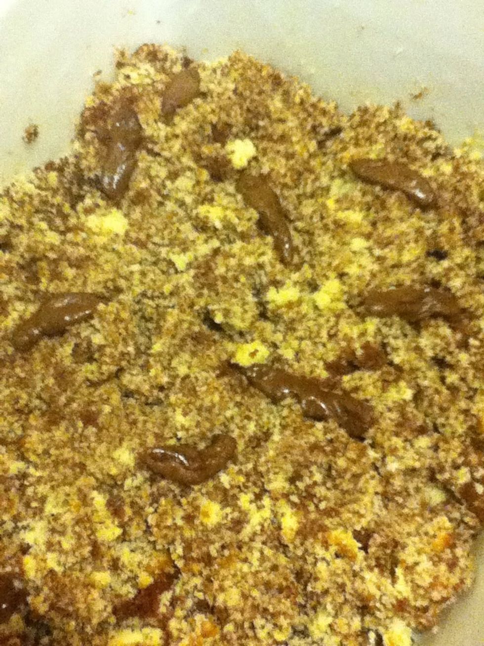 Sprinkle the tootsie rolls with the rest of the normal colored cookie crumbs to make it look the litter has been kicked onto them.