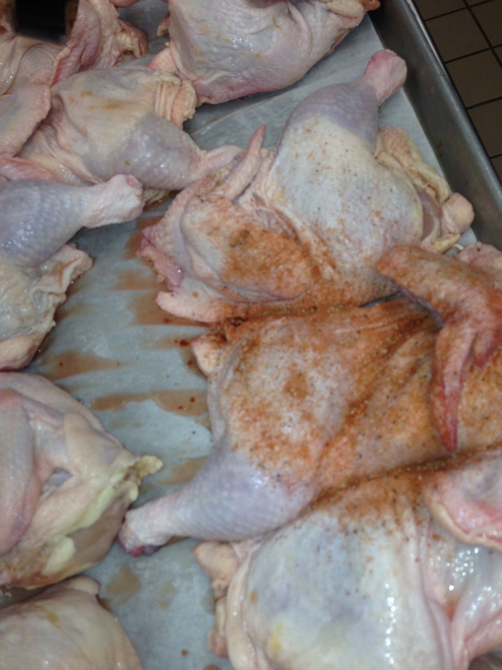 Sprinkle the top side of the chicken halves with BBQ Dry Rub Seasoning. Be sure to constantly move the can to avoid heavy spots of the rub.