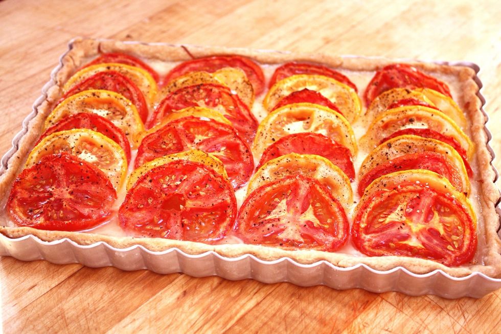 Sprinkle the top with kosher salt and black pepper, and bake in a preheated 350\u00b0 oven until the crust is golden brown, about 25 to 30 minutes. Check the tart after 20 minutes.