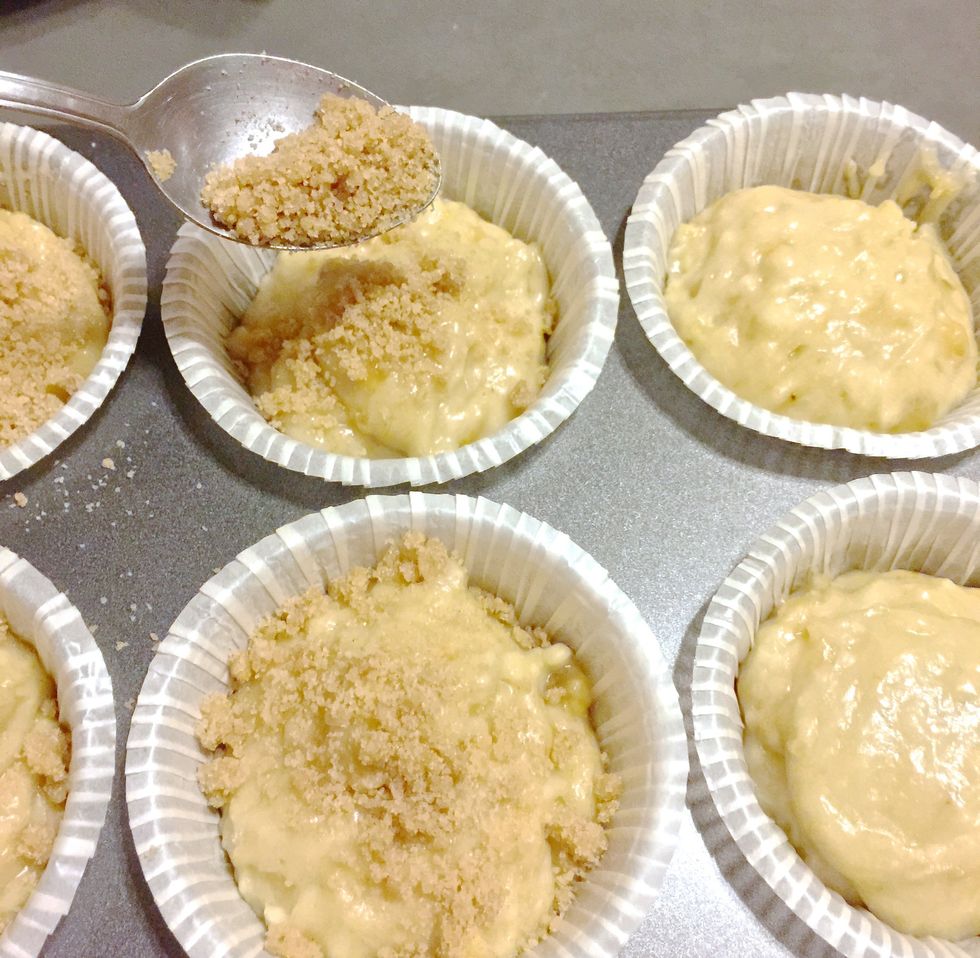 Sprinkle the topping over the muffins.