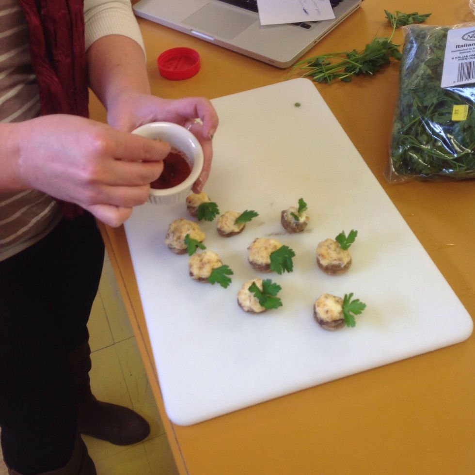 Sprinkle the tops with either paprika or Cayenne pepper (if you want it spicy.)