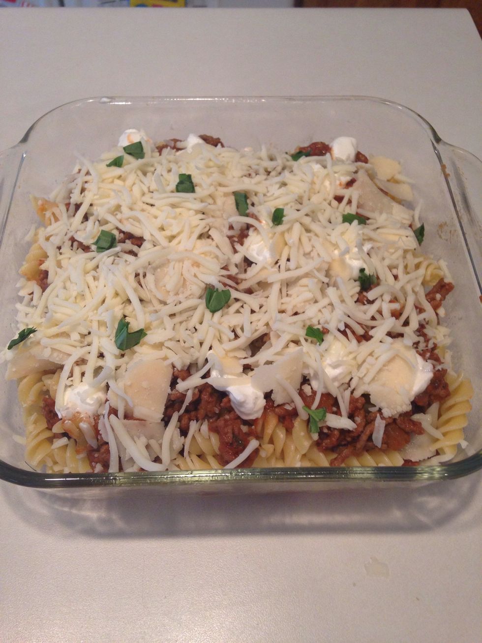 Sprinkle with chopped basil or save this step for after baking, your choice.