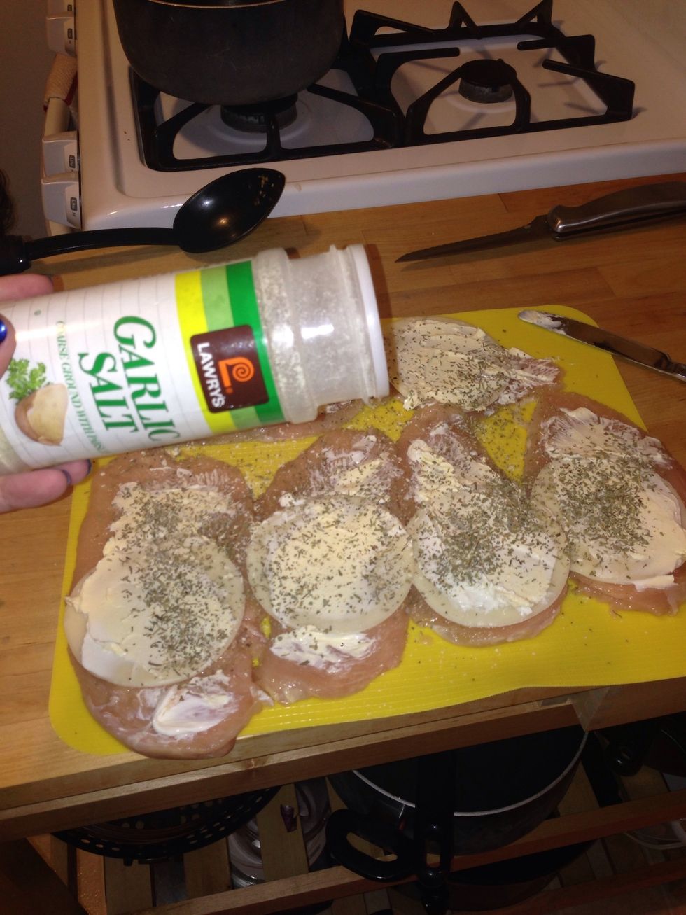 Sprinkle with garlic salt. Probably about a pinch per breast.
