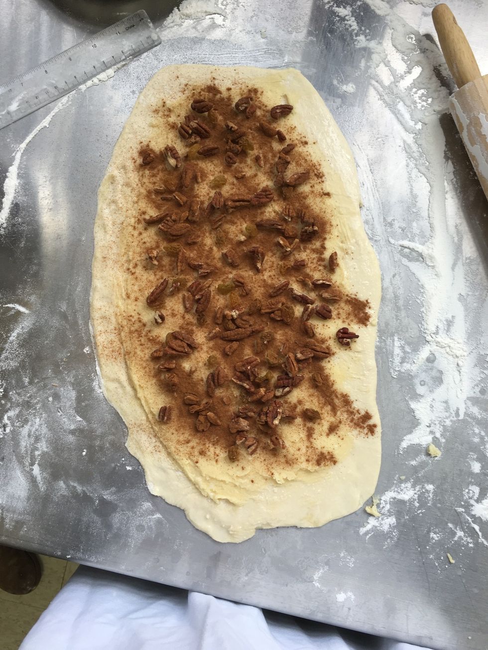 Sprinkle with nuts, raisins, and ground cinnamon,