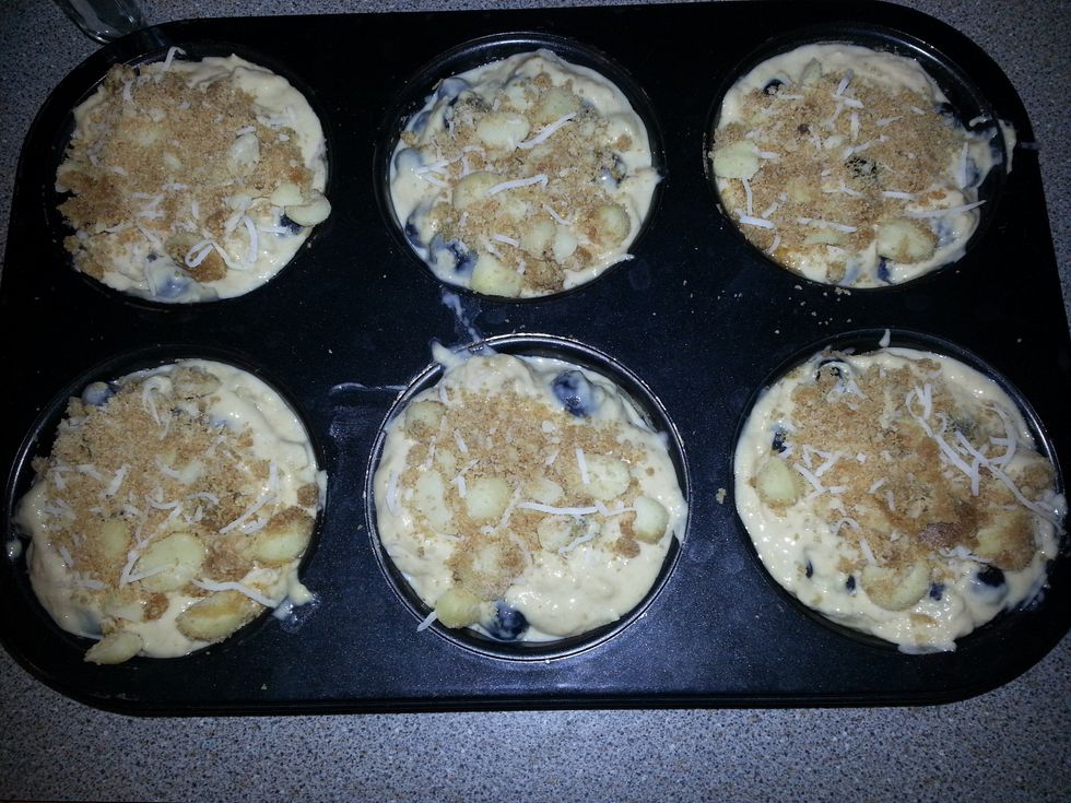 Sprinkle with the reserved macadamia topping and gently press into the batter.