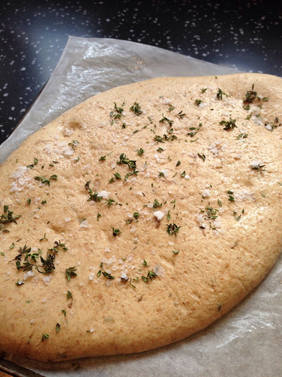 Sprinkle with thyme and sea salt. Put a baking stone or heavy baking tray into the oven to heat