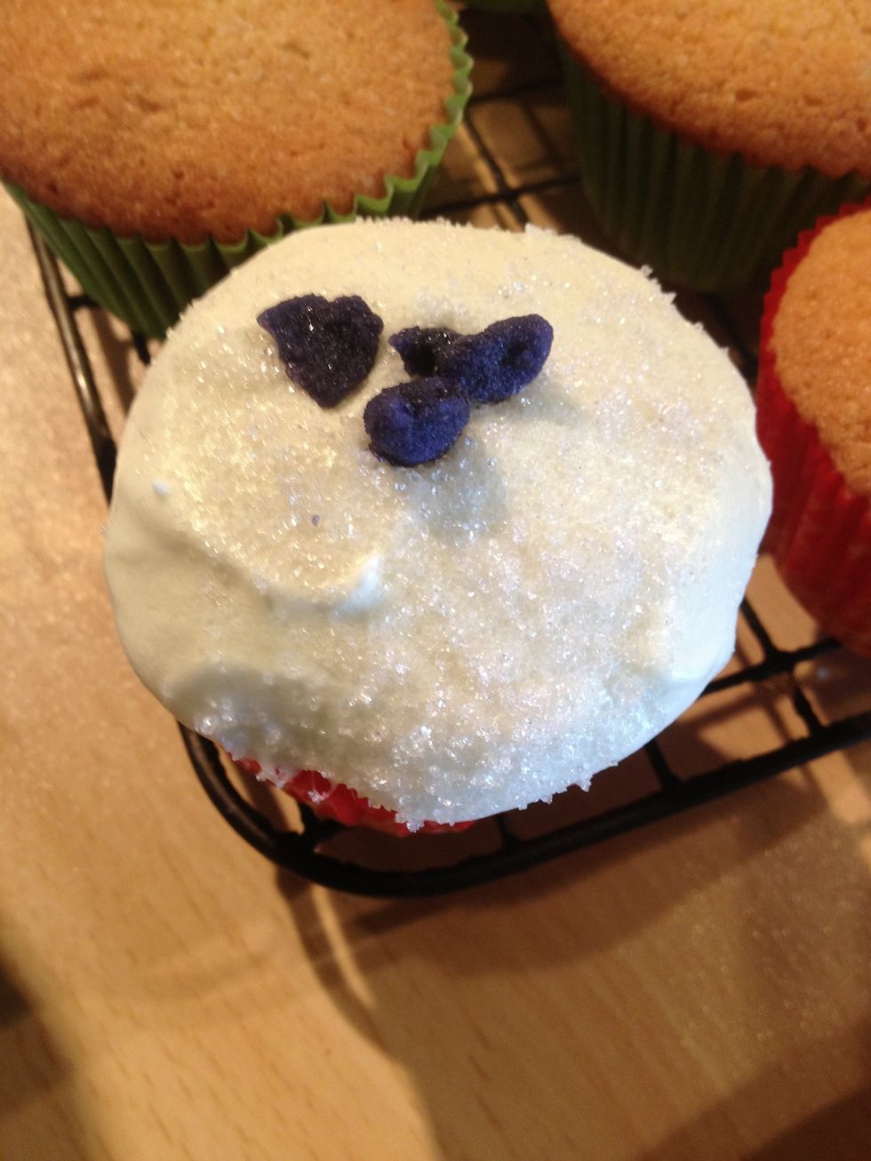 Sprinkle with violet sugar and add some crystallised petals. Alternatively you could just pipe the buttercream on.