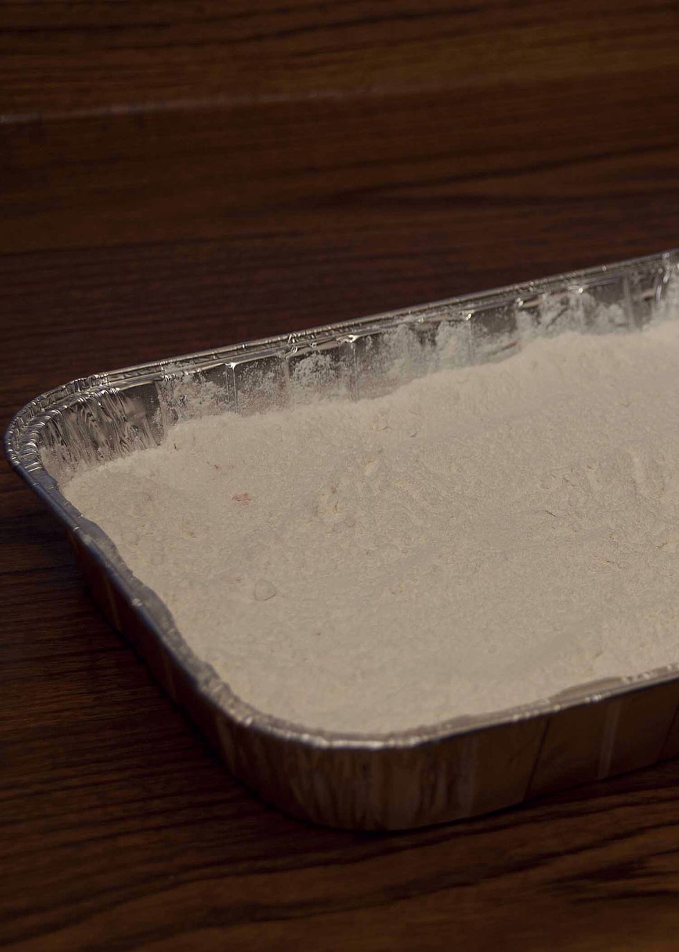 Sprinkle your cake mix on top of the cherry/pineapple layers. I use a fork to evenly spread them. Make sure you get it all the way to the edges!