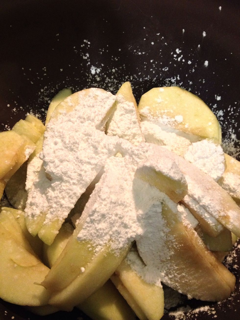 Sprinkle your corn starch and toss it with your apples.
