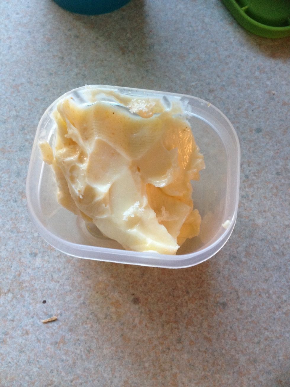 Sprinkle your garlic powder into your butter/margarine. Use as much as you like! Depends on how you like your bread.. But don't put too much in