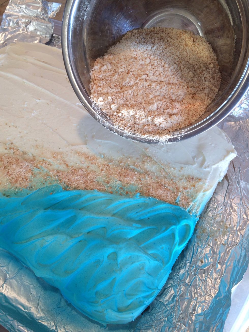 Sprinkle your "sand" on the rest of the cake.