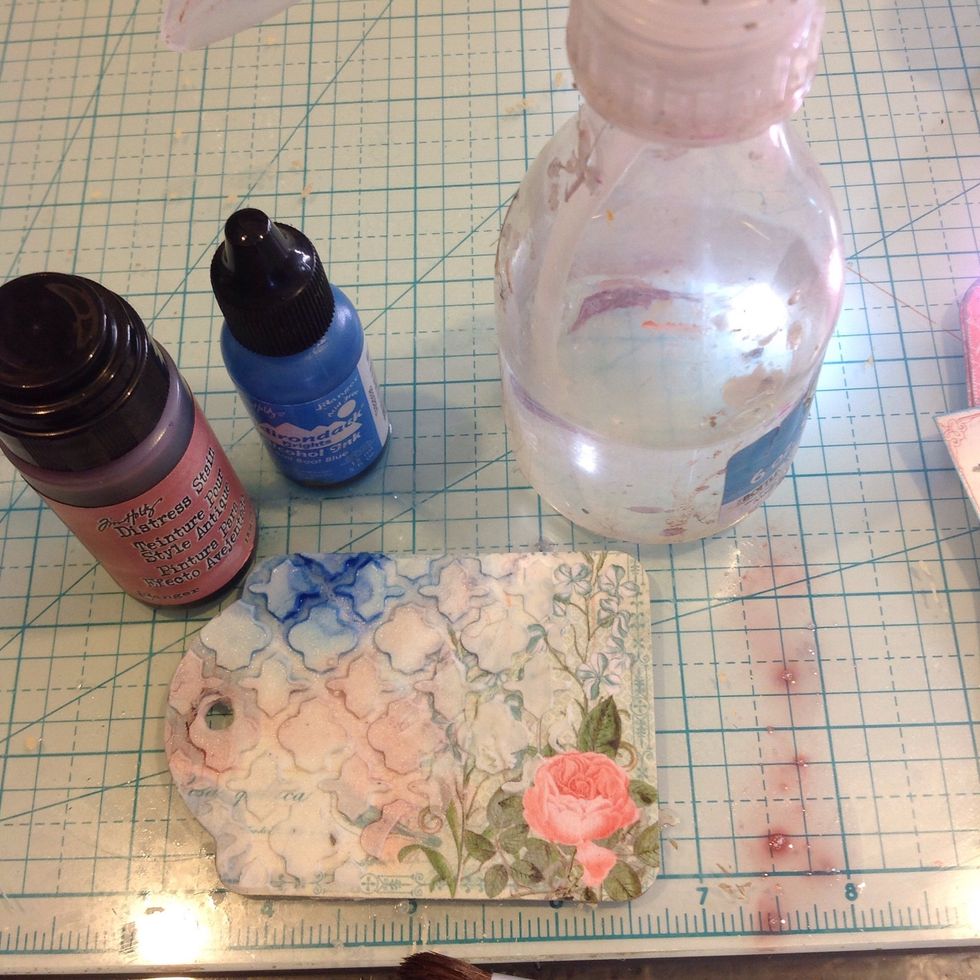 Spritz it with water then apply inks and sprays. I used alcohol inks and distress stains.