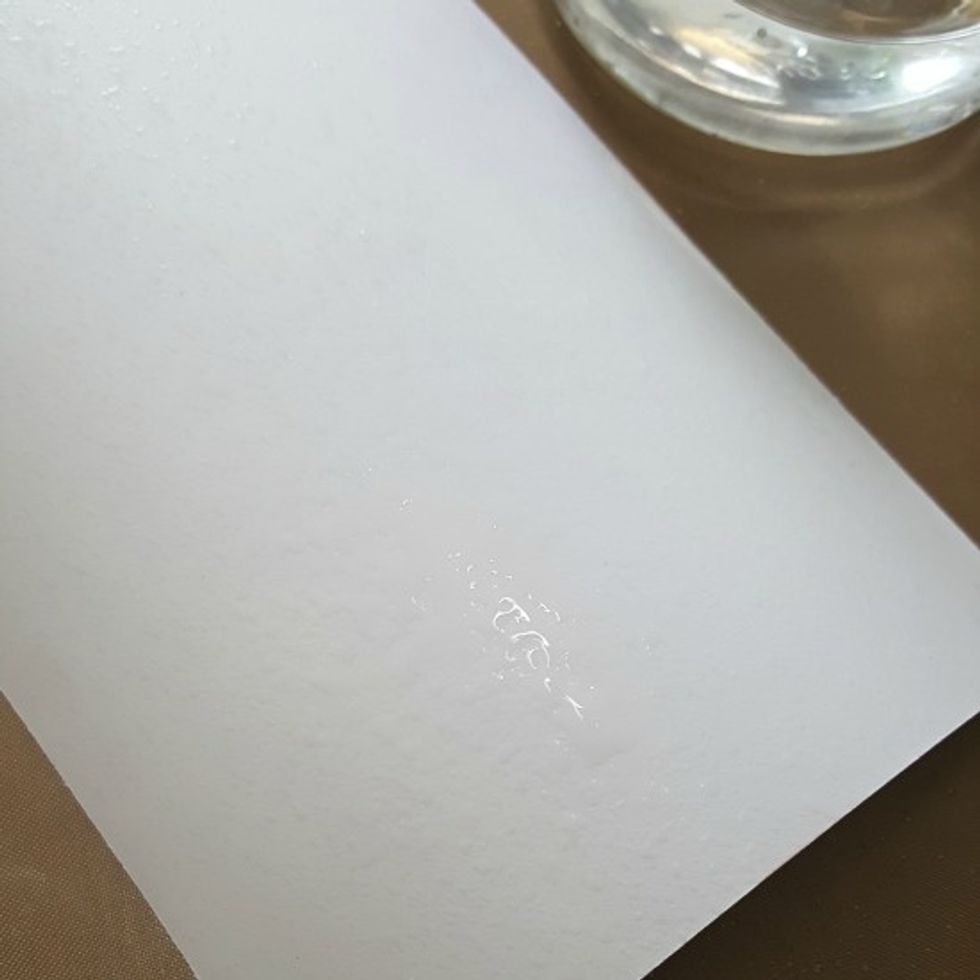 spritz some water onto mixed media paper