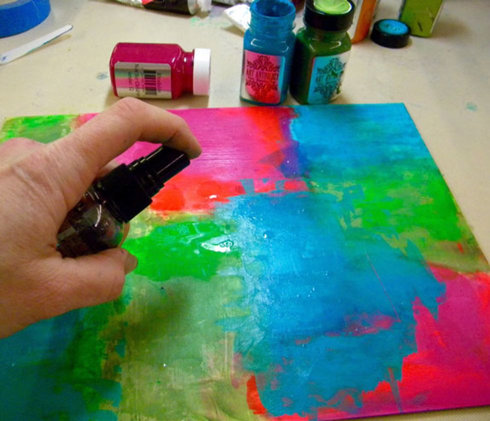 Spritz some water onto the paint and let it sit for a few minutes, then scrape over it with the key card.