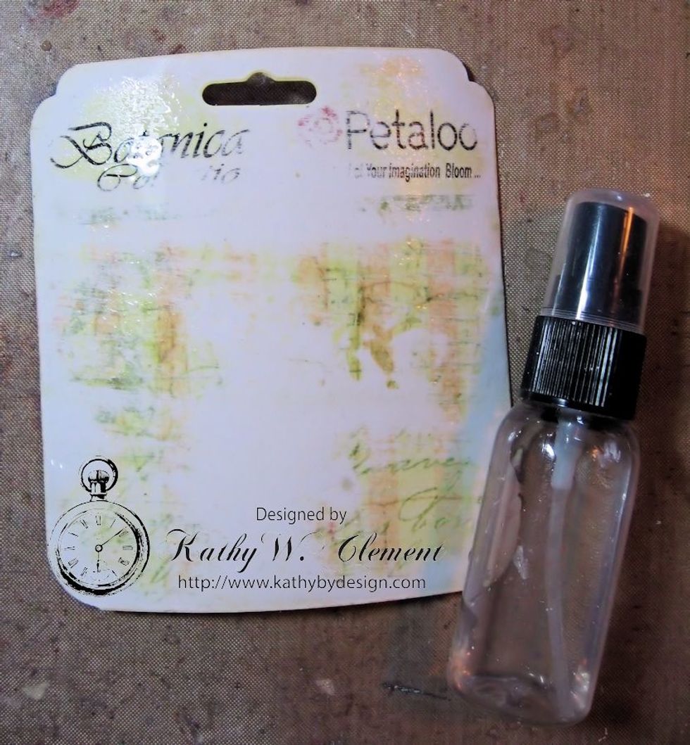 Spritz the front and the back of the shaped tag with a mister bottle. Don't saturate it, just dampen it.