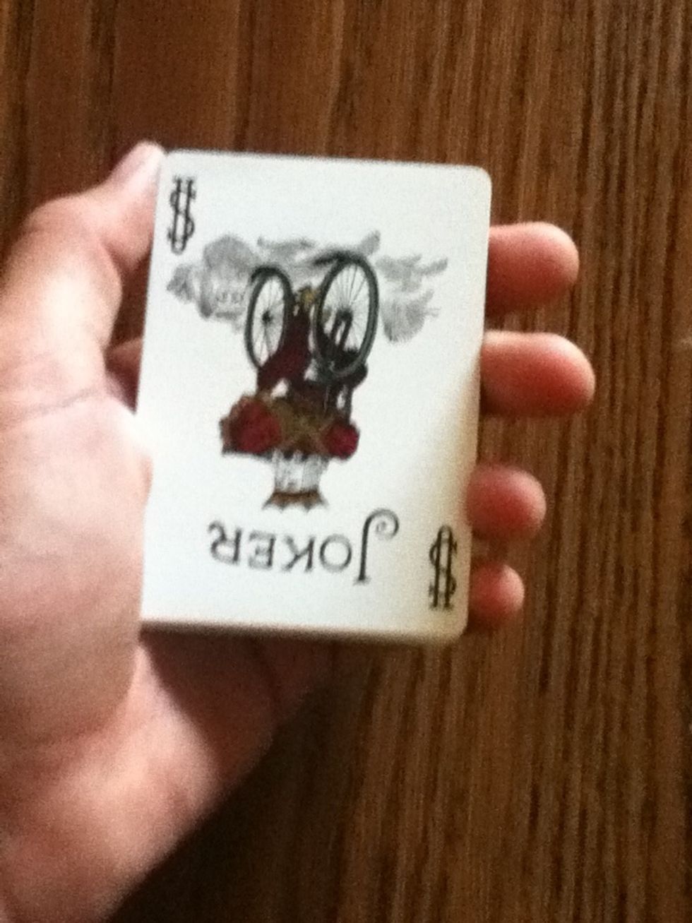 Square it up, as you do it there card the one the you pulled behind the other cards, there card will be on the bottom.