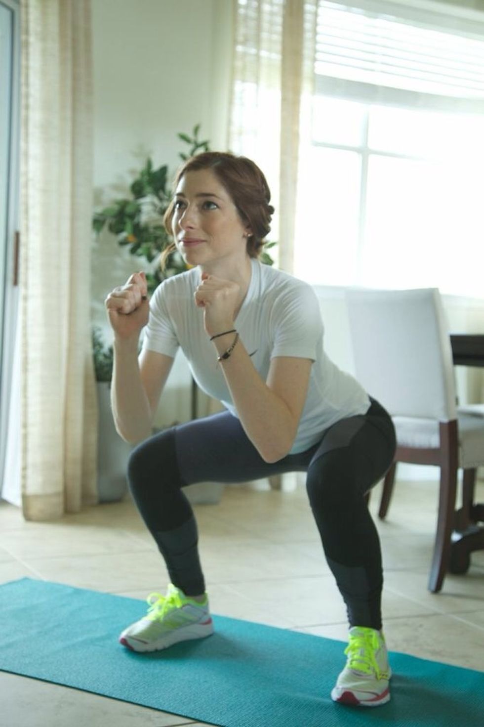 Squats: Stand with feet shoulder width apart. Bend the knees and lower the torso while keeping the bum out. Hold, then slowly rise back to starting. Continue for 1 minute.