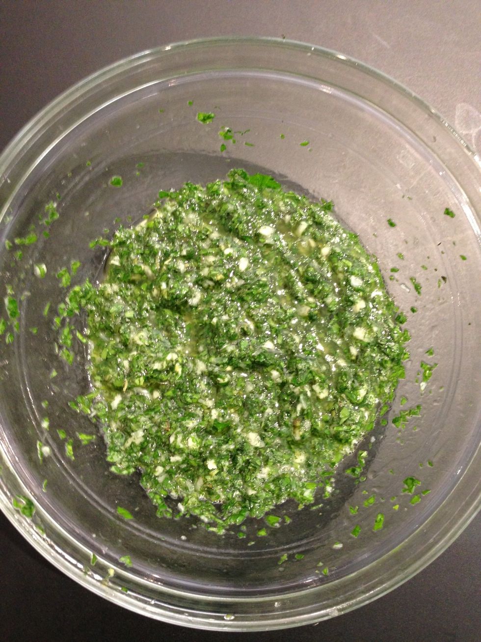 Squeeze 1 lemon add olive oil peel and crush the garlic add to the lemon-oil. Mince the parsley and the mint.
