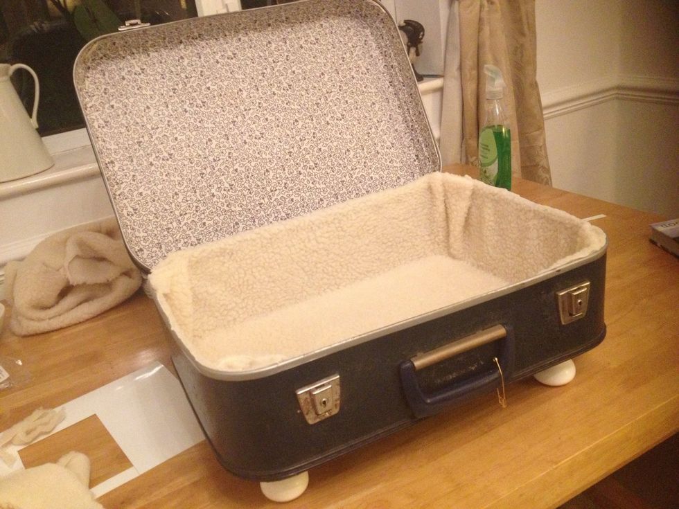 Squeeze a line of glue on the inside edges of the case and hold fabric in place. I used a heavy book to assist here. Doing 2 sides at a time allowing 30mins drying time.