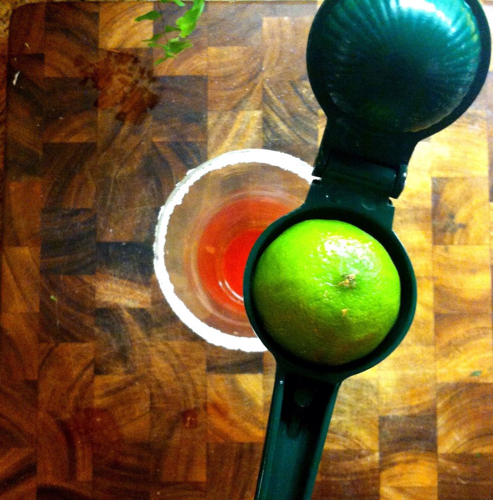 Squeeze half of a lime into the cup. You can add more lime if you prefer a zestier taste.
