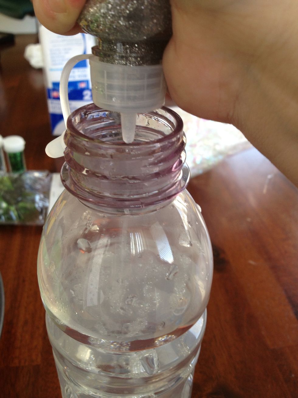 Squeeze in all of the glue and shake the bottle to mix it together.