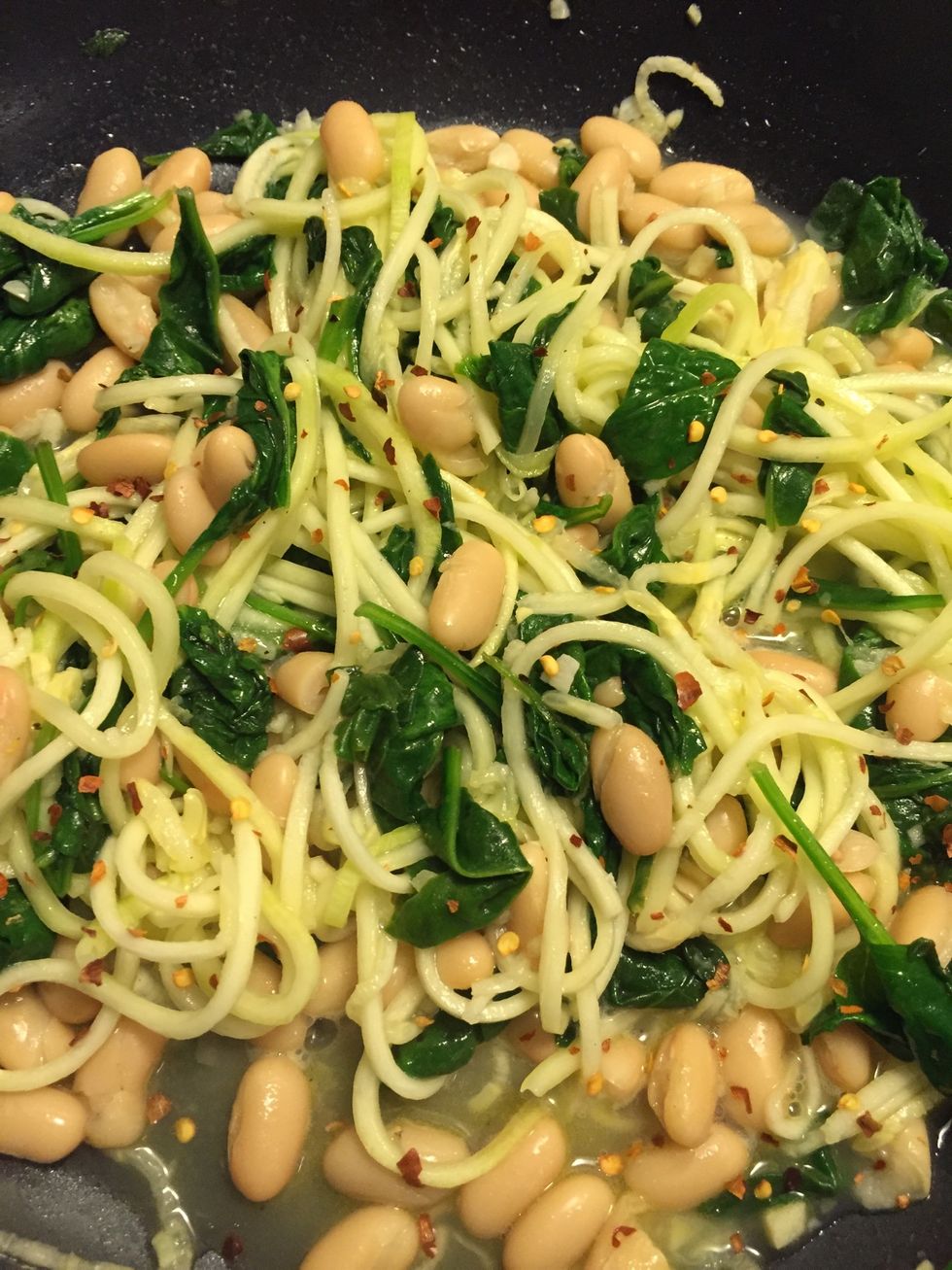 Squeeze in the lemon juice & add red pepper flakes. Toss to combine all the ingredients. Cook a few minutes depending on how crunchy you want the zoodles.