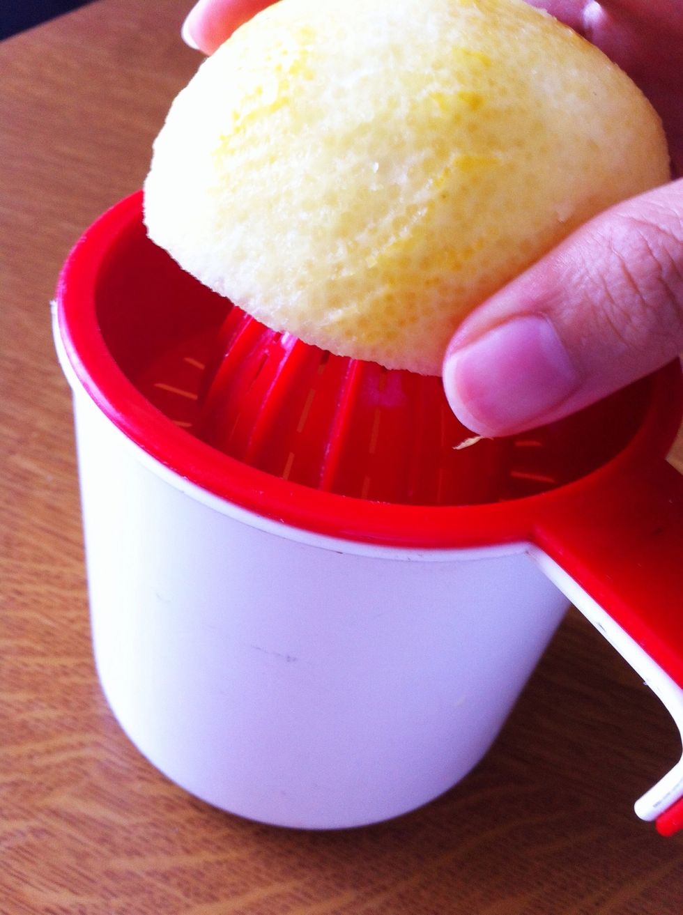 Squeeze juice out of lemon