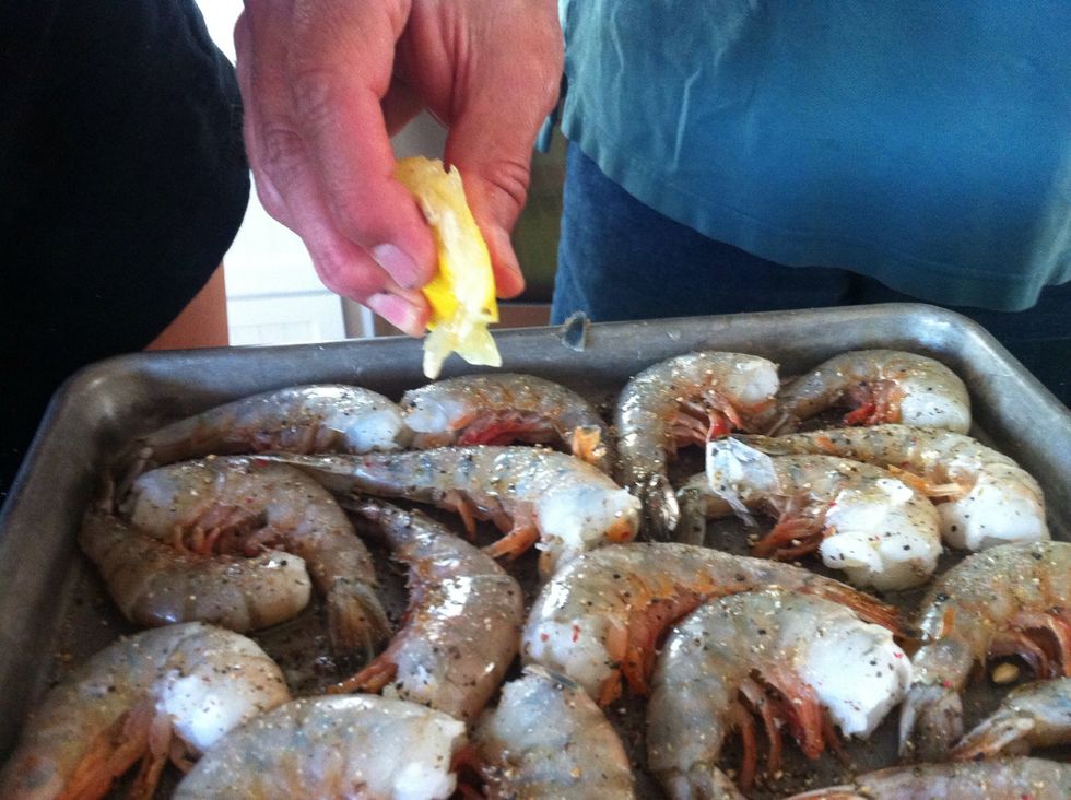 Squeeze lemon juice onto shrimp