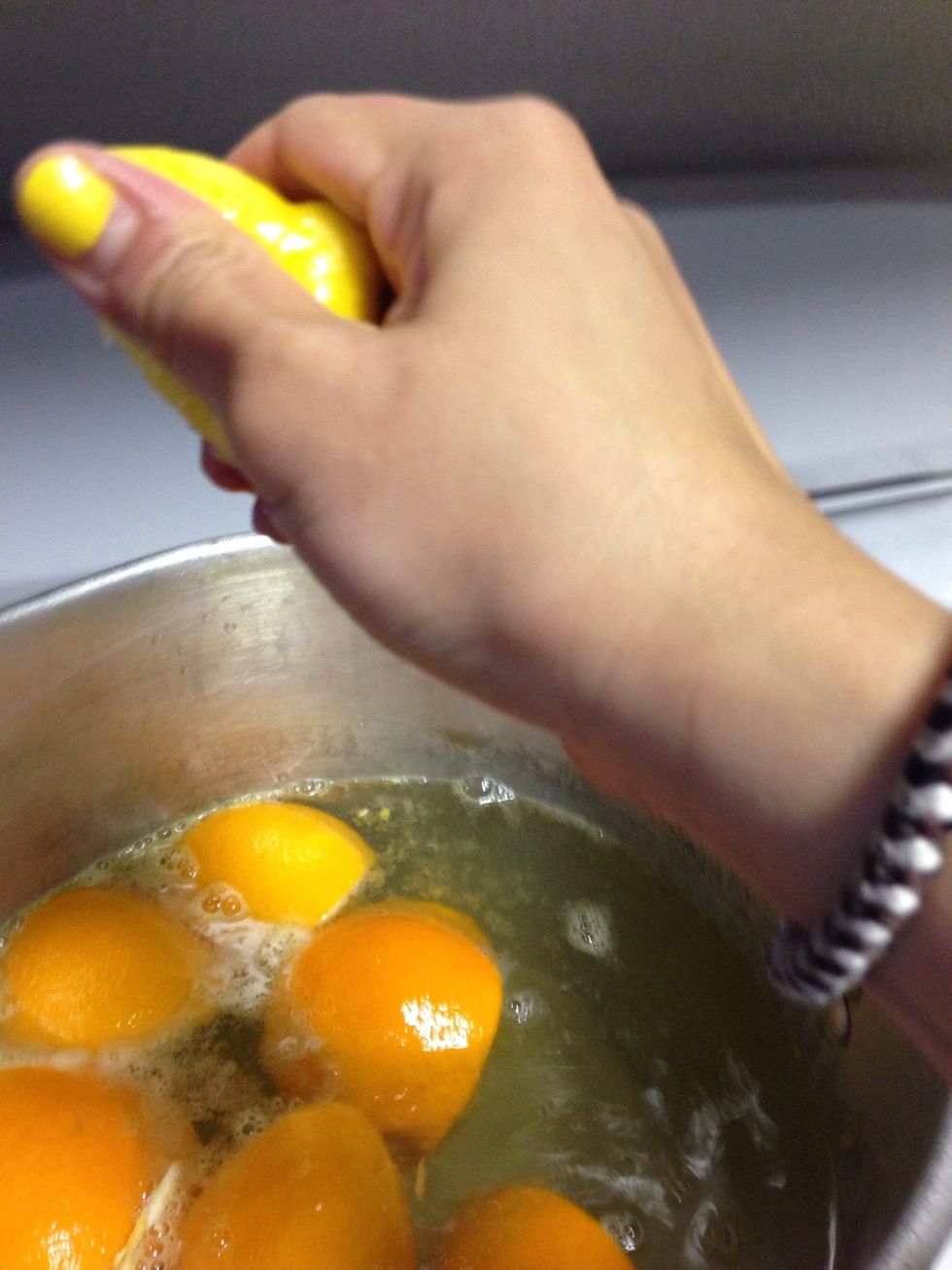 Squeeze lemon juice then add peel in the water