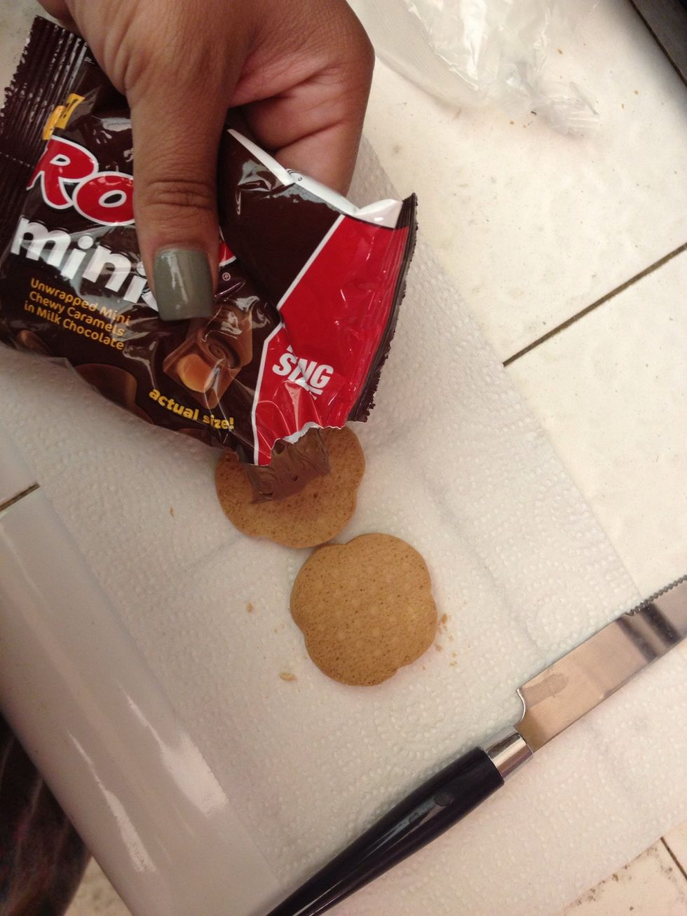 Squeeze melted Rolos from bag onto a cookie & spread around with knife
