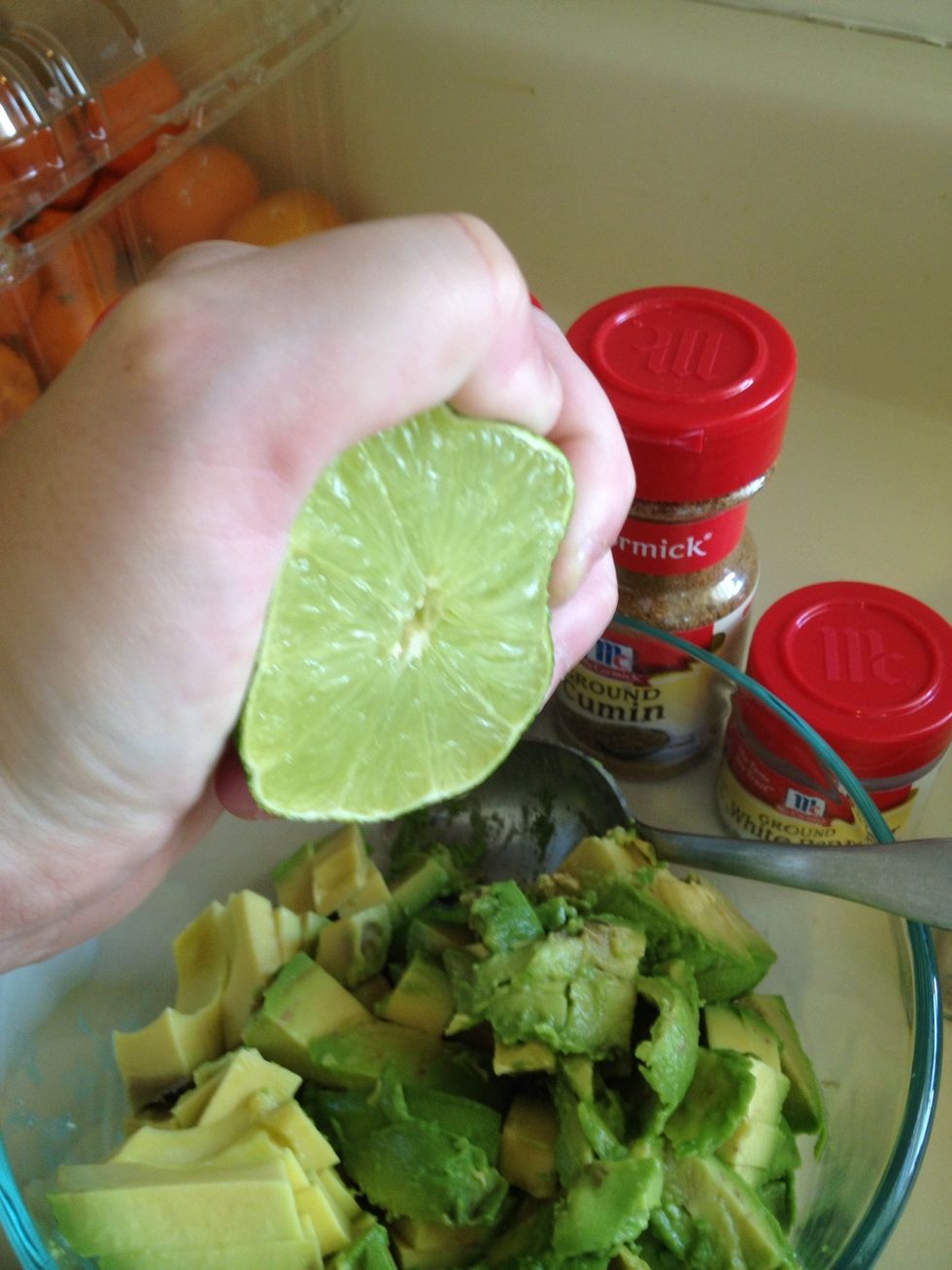 Squeeze one half of lime. This prevents browning of your avocados too.