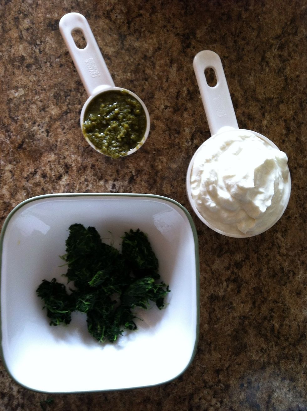 Squeeze spinach dry, measure 1 cup plain Greek yogurt, 1/4 cup pesto, pinch of salt, and pinch of pepper.