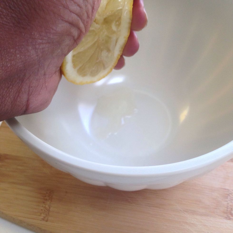 Squeeze that sucker! If you have a lemon squeezer, it's its' turn to shine. If not try this: stick the lemon half between your lower palms, intertwine your fingers and squeeze real tight!