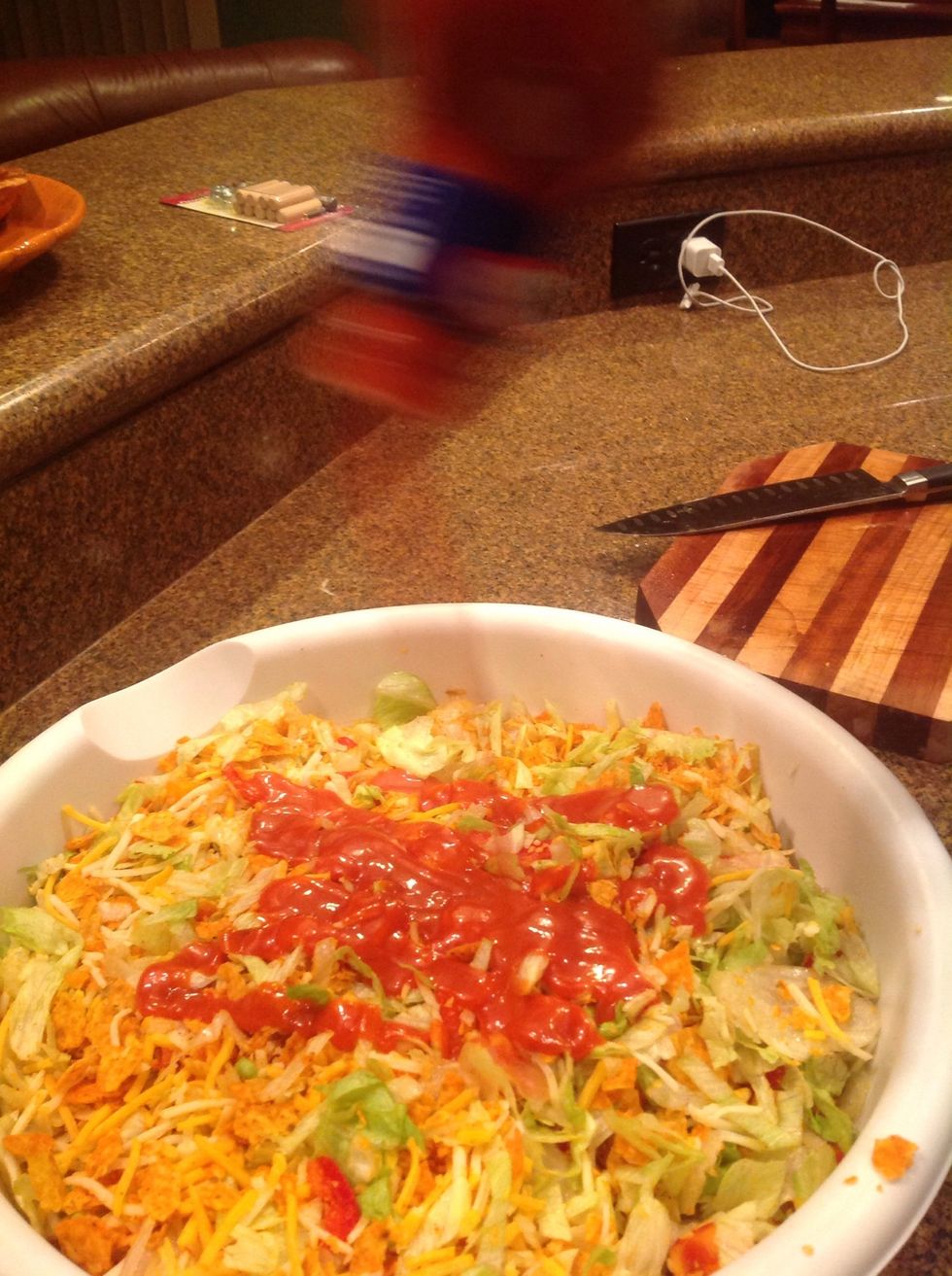 Squeeze the Catalina dressing onto every ingredient in the bowl. Do not mix it after putting it in.