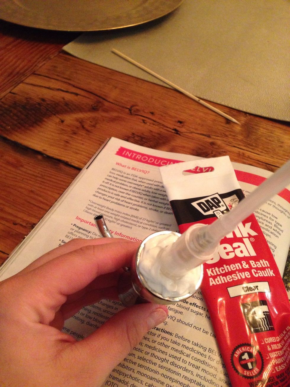 Squeeze the caulk into the top.