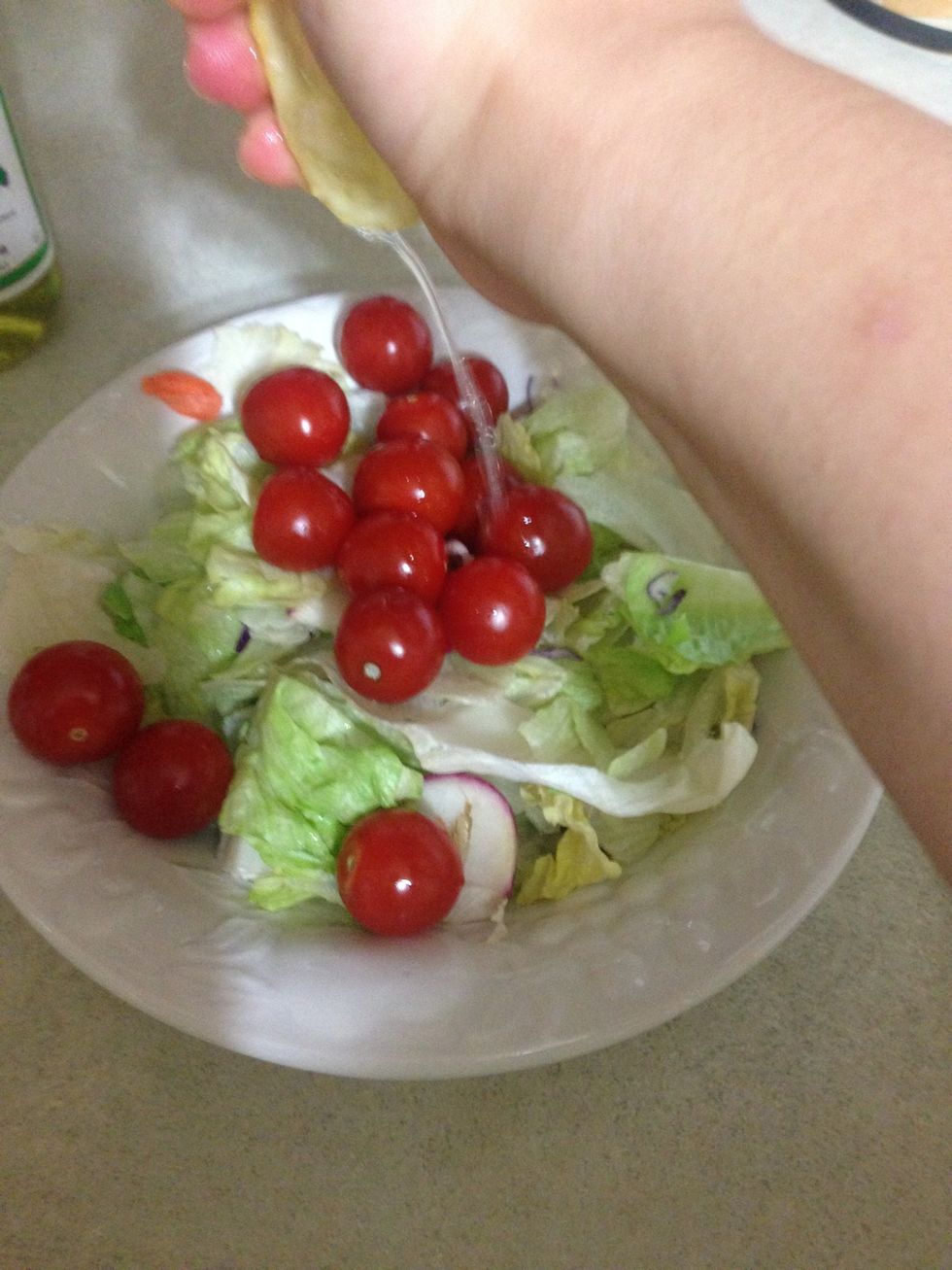 Squeeze the entirety of the lemon onto the vegetables (after slicing lemon in half)