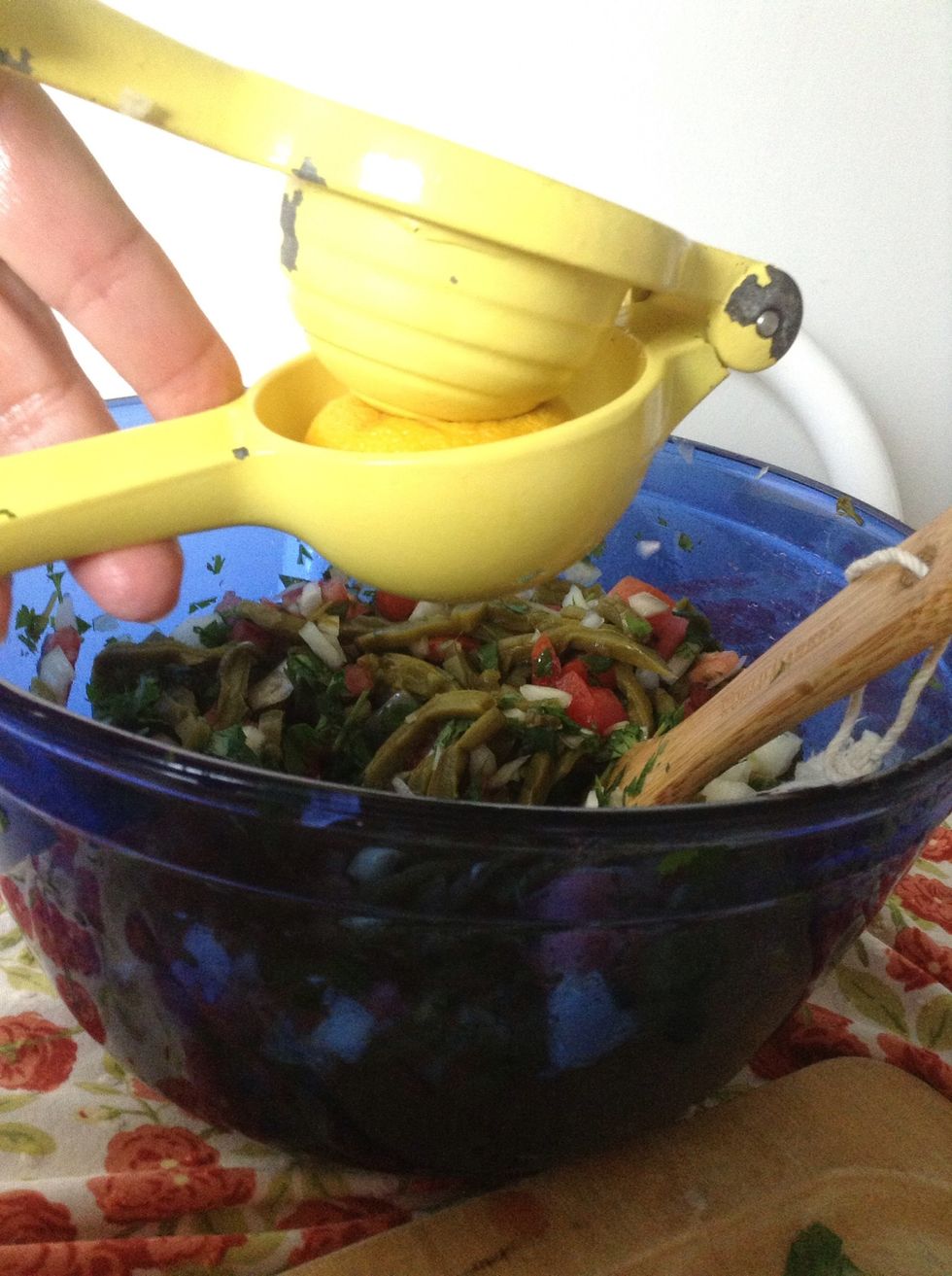 Squeeze the lemon juice from two lemons into the bowl.