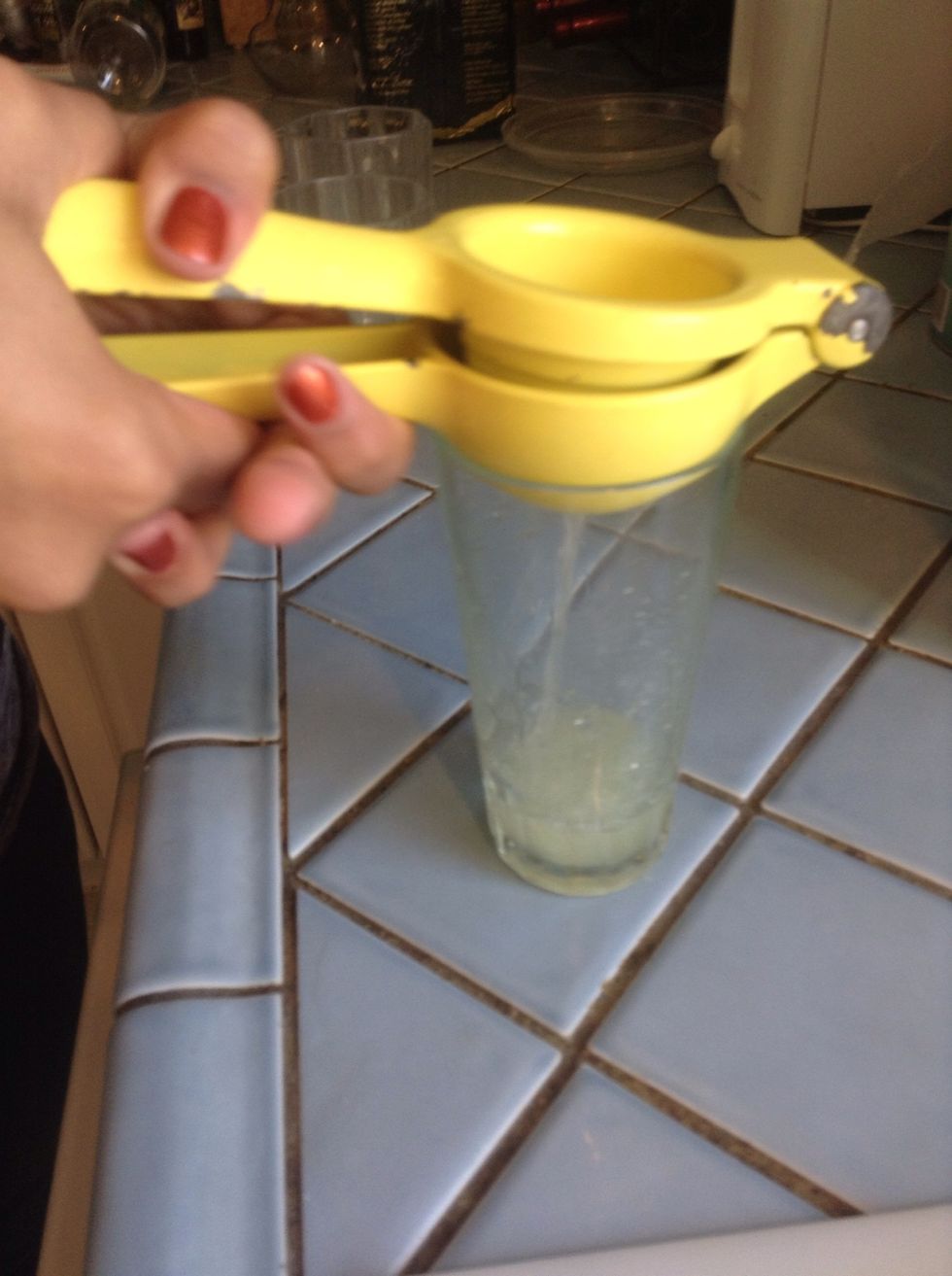 Squeeze the lime juice into a glass.