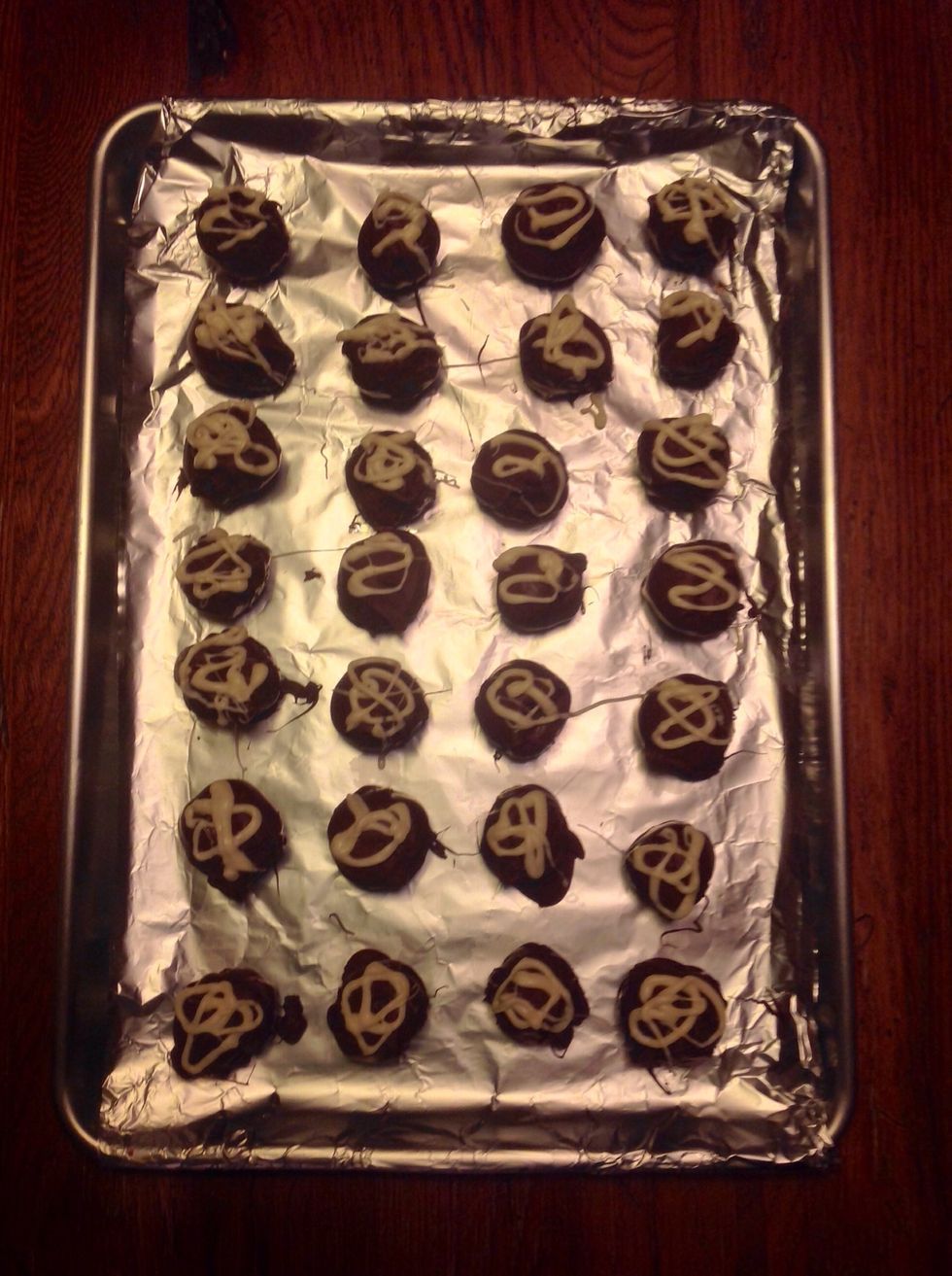 Squeeze the melted white chocolate onto each Bon Bon.