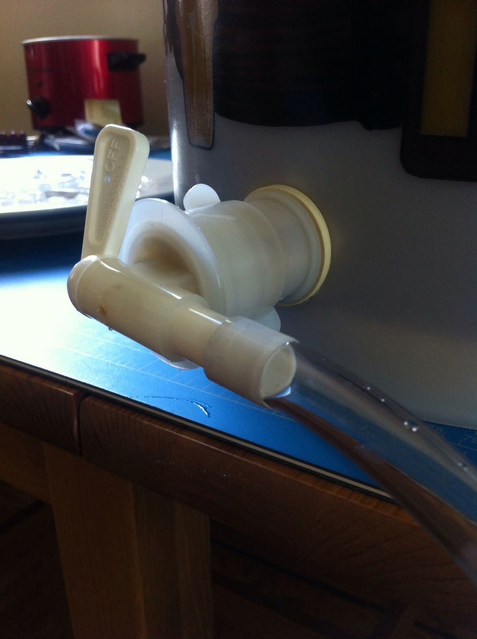 squeeze the tube on to the spout at the bottom of the primary. get rough with it.