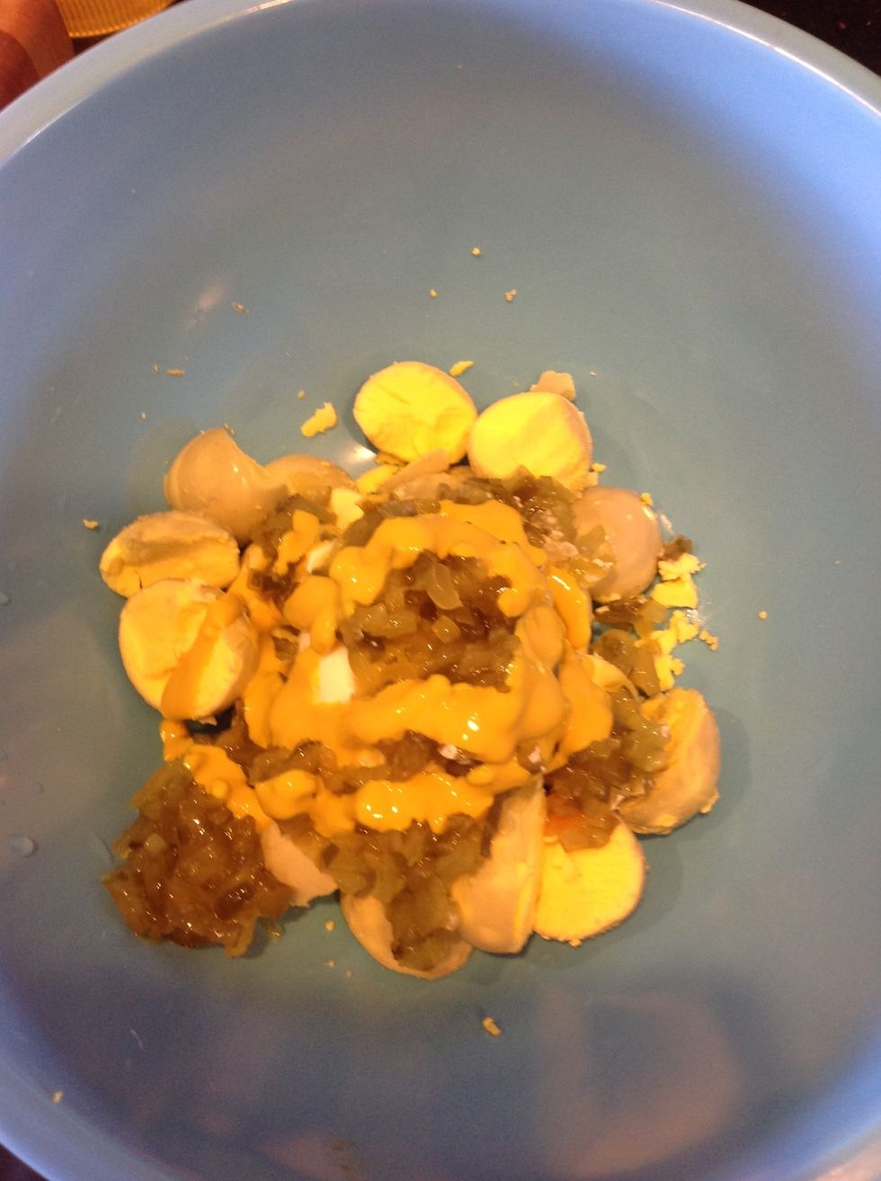 Squirt a small amount of yellow mustard in, but don't overdue it. It's more for color than taste.