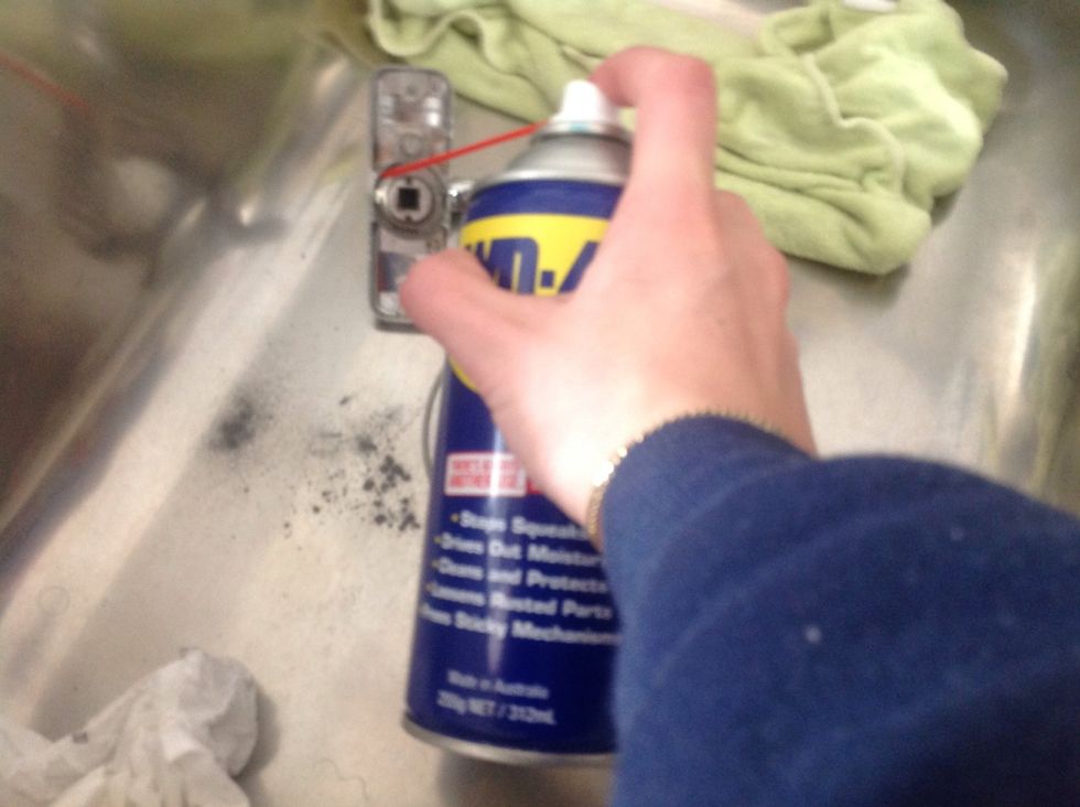 Squirt the lubricant into the turning parts of the handle