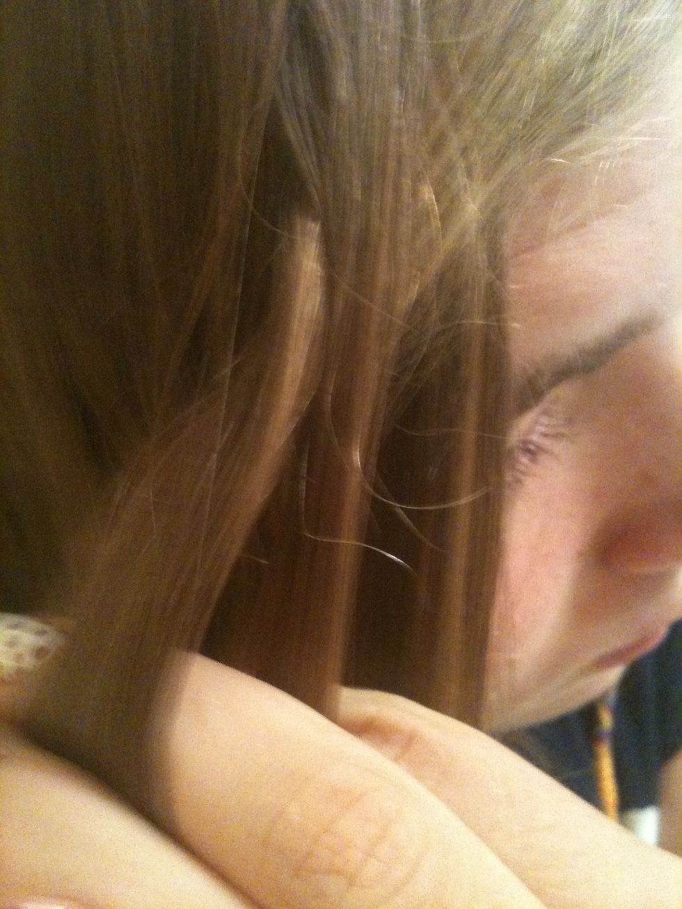 Srry for the bad pic! Just take a piece of hair and cross it over a couple times like a regular braid. I'm using the front part of my bangs. Bigger piece=bigger braid