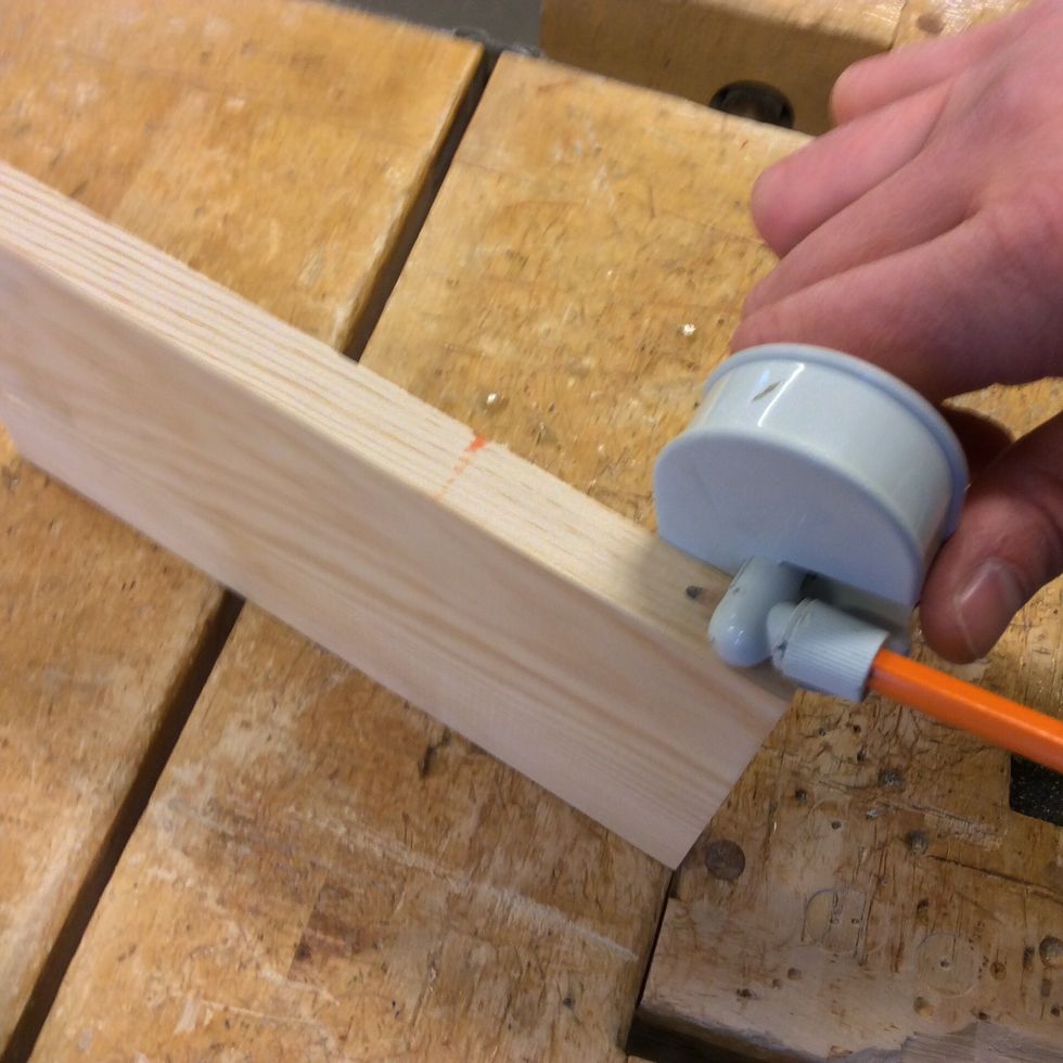 St\u00e4ll in en strykm\u00e5tt p\u00e5 halva br\u00e4dans bredd.