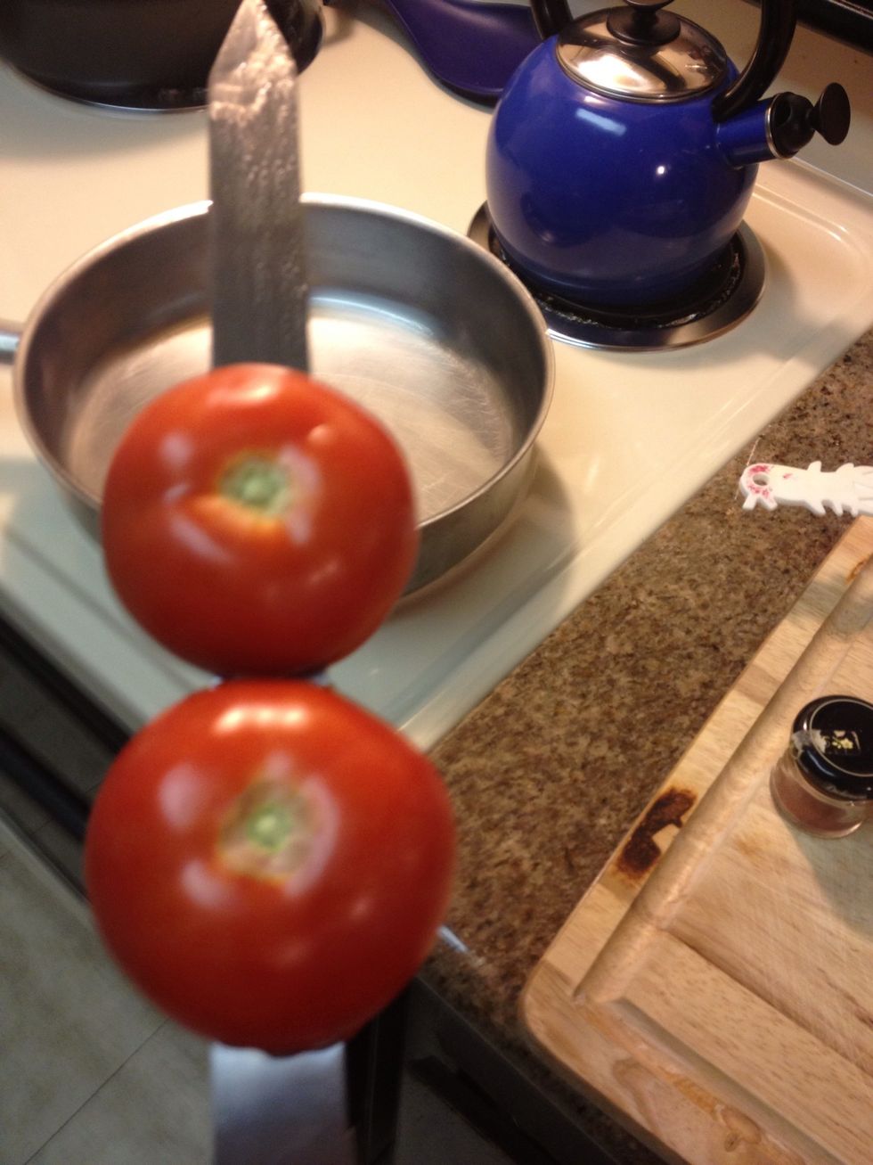 Stab a couple tomatoes.  You can add an onion too. Get these on the grill first & cook for about 10 minutes then finish in a warm oven for another 7-10 minutes until soft.